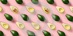 Avocado pattern on pink background. Pop art design, creative summer food concept. Green avocadoes, minimal flat lay