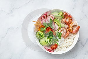 Avocado, prawn, cucumber, tomato, radish, carrot and rice salad bowl. Healthy food