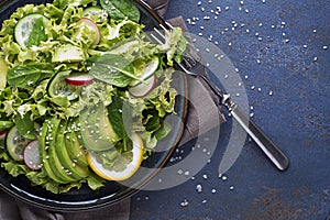 Avocado salad with green lettuce and sesame
