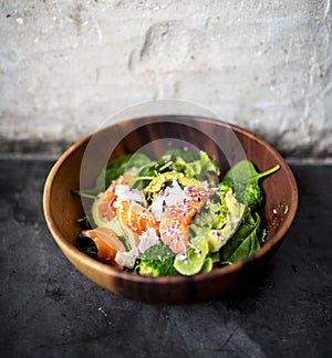 Avocado salmon salad healthy food in rustic style