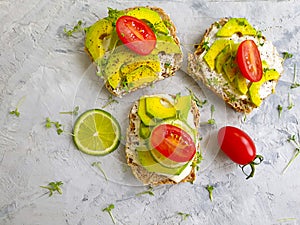 Avocado sandwich seasoning minimal exotic nutritious lifestyle on concrete background, recipe tomato