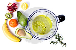 Avocado smoothie in a blender with various ingredients