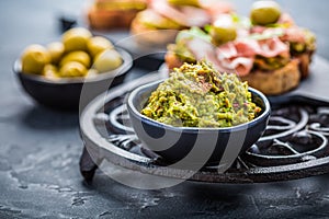 Avocado spread, guacamole with fried bread, substitute for toast and olives