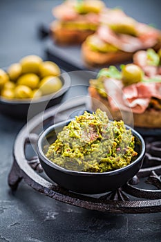 Avocado spread, guacamole with fried bread, substitute for toast and olives