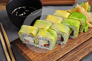 Avocado sushi roll with salmon cucumber and cream cheese