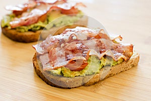 Avocado toast with cherries tomatoes and bacon