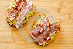 Avocado toast with cherries tomatoes and bacon