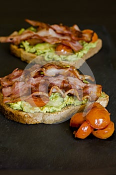 Avocado toast with cherries tomatoes and bacon