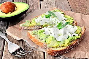 Avocado toast with egg whites and pea shoots