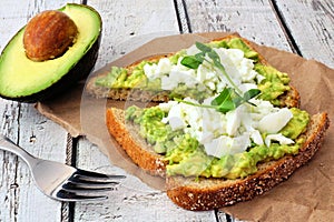 Avocado toast with egg whites and pea shoots