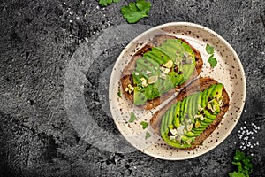 Avocado toast. Healthy toast with avocado for breakfast or lunch with rye bread. Clean eating, dieting, vegan food concept. Food