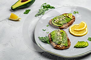 Avocado toast. Healthy toast with avocado for breakfast or lunch with rye bread. Clean eating, dieting, vegan food concept. top