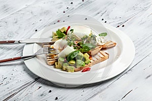 Avocado, toast, poached egg on plate. Breakfast concept. banner, menu, recipe place for text, top view