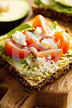 Avocado toast with tomatoes and feta