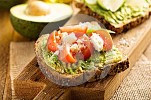 Avocado toast with tomatoes and feta