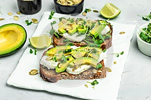 Avocado toasts with rye bread, Delicious breakfast or snack, Clean eating, dieting, vegan food concept. top view
