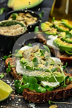 avocado toasts with rye bread, Delicious breakfast or snack, Clean eating, dieting, vegan food concept. top view