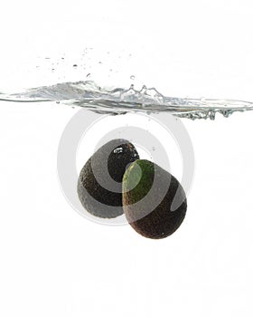 Avocadoes Splashing in water