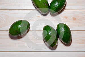 Avocados fruit on the wood table with pink wall background part 2