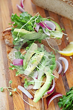 Avocados and onions with smoked salmon sandwich