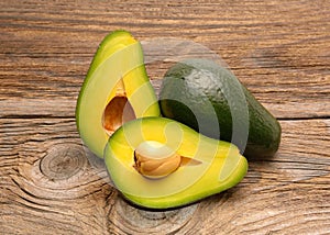 Avocados on a wood table photo