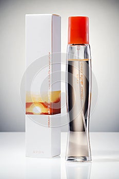 Avon Summer white sunset cologne isolated on gradient background.