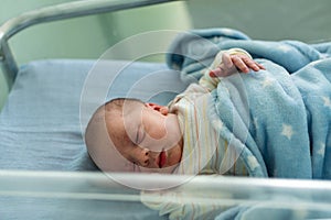 Awake Newborn Baby Face Portrait Acne Allergic Irritations Early Days Grimace Crying On Blue Background. Child Start