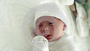 Awake Newborn Baby Face Portrait Acne Allergic Irritations Early Days Sneeze On White Background. Child Start Minutes Of