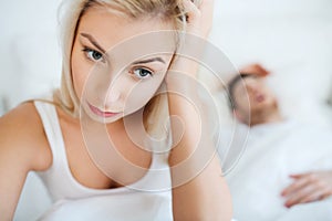 Awake woman having insomnia in bed