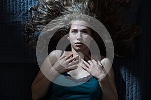 Awaken woman having nightmare photo