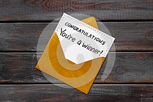 Award letter You Re A Winner in golden yellow envelope. Congratulations concept