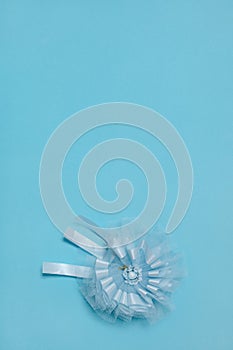Award ribbon for baby shower party on blu light background