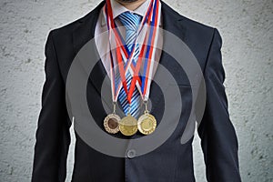 Awarded businessman is wearing many medals