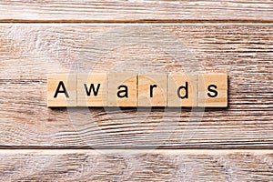 AWARDS word written on wood block. AWARDS text on wooden table for your desing, concept