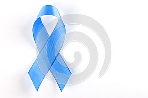 Awareness blue ribbon on white background and for prostate cancer awareness campaign and men`s health concept