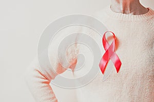 Awareness month motion design with pink silk ribbon.