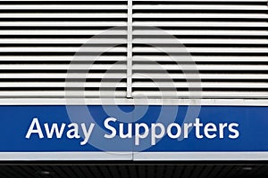 Away supporters entrance sign on a wall