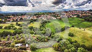 Awe aerial view from green hills of Rignano Flaminio village in italy surrounded by forest and countryside