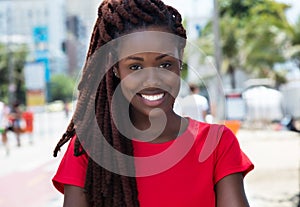 Awesome african woman with dreadlocks in the city