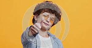 Awesome idea. Cool little boy in sunglasses gesturing thumb up