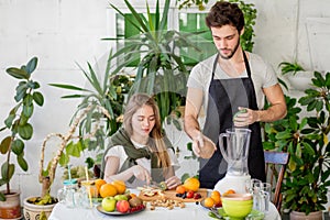 Awesome man is choosing fresher fruits for cocktail