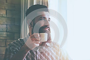 Awesome man drinking morning coffee