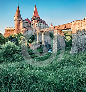 Awesome morning view of Hunyad Castle / Corvin`s Castle. Stunning summer cityscape of Hunedoara, Transylvania, Romania, Europe. R