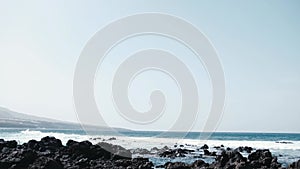 Awesome power ocean waves breaking over dangerous rocks