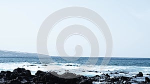 Awesome power ocean waves breaking over dangerous rocks