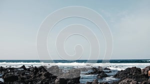 Awesome power ocean waves breaking over dangerous rocks