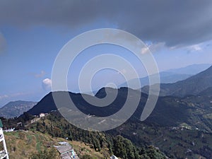 An awesome rare panoramic view of villages and mountains with conifer trees