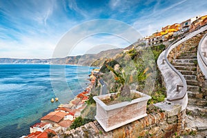 Awesome seaside and town Scilla with old medieval castle on rock Castello Ruffo