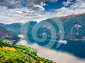 Awesome summer view of Sognefjorden fjord. Colorful morning scene with Aurlandsvangen village, Norway. Traveling concept