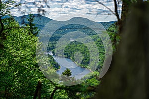 Awesome summer view from a verdant hill in Jacques Cartier National Park, Quebec province, Canada